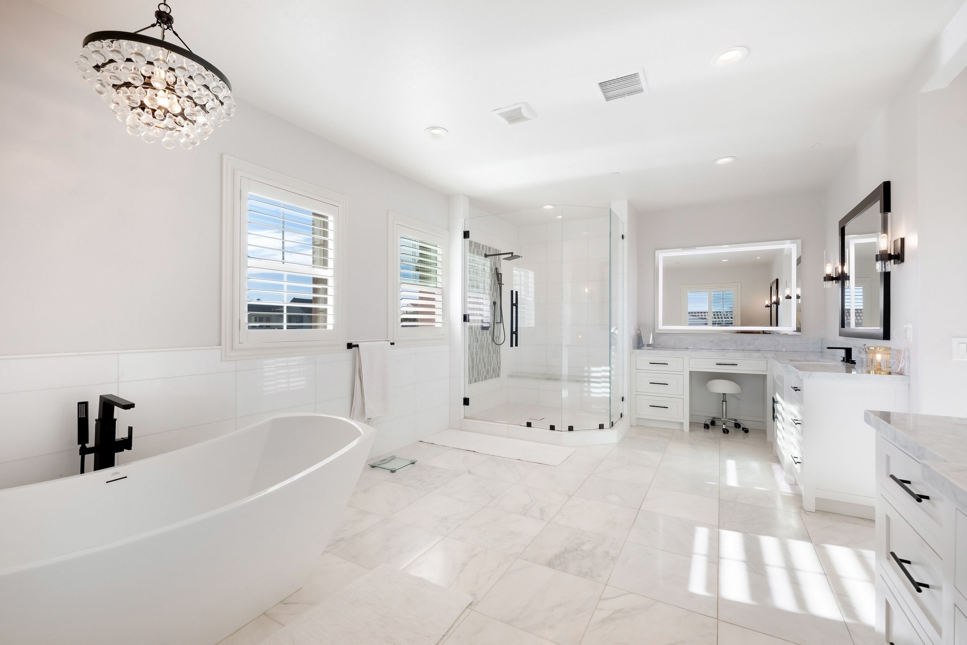 Bright and elegant bathroom with large windows in a luxury home