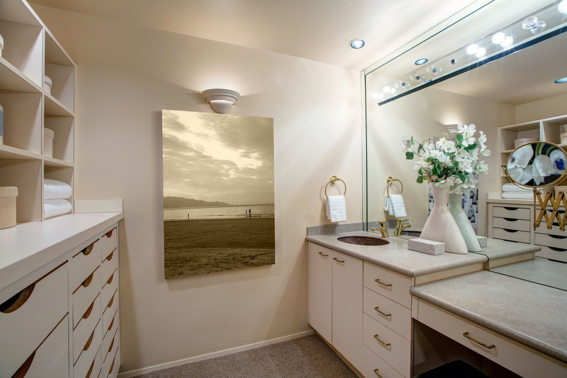Narrow walk-in closet features make up vanity